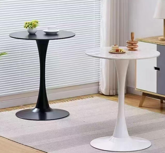 Black and white tall side tables by a window
